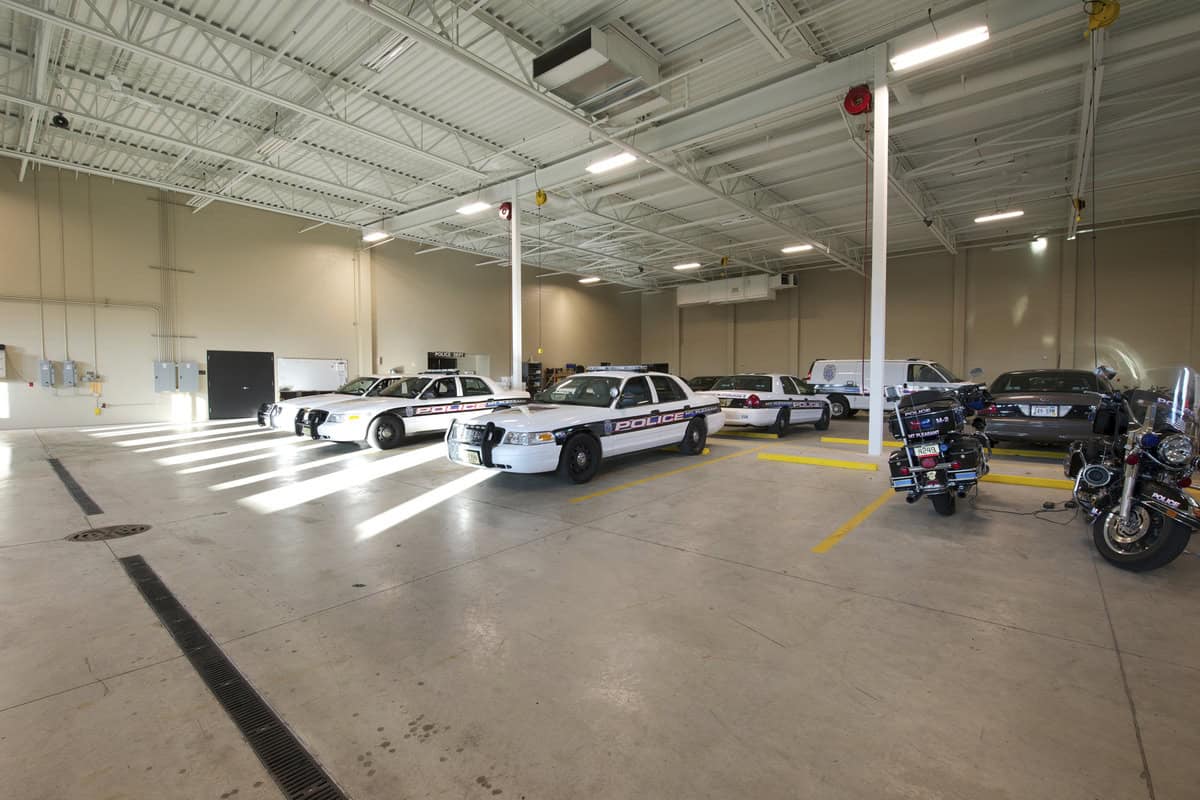 Parked police cars in parking garage.