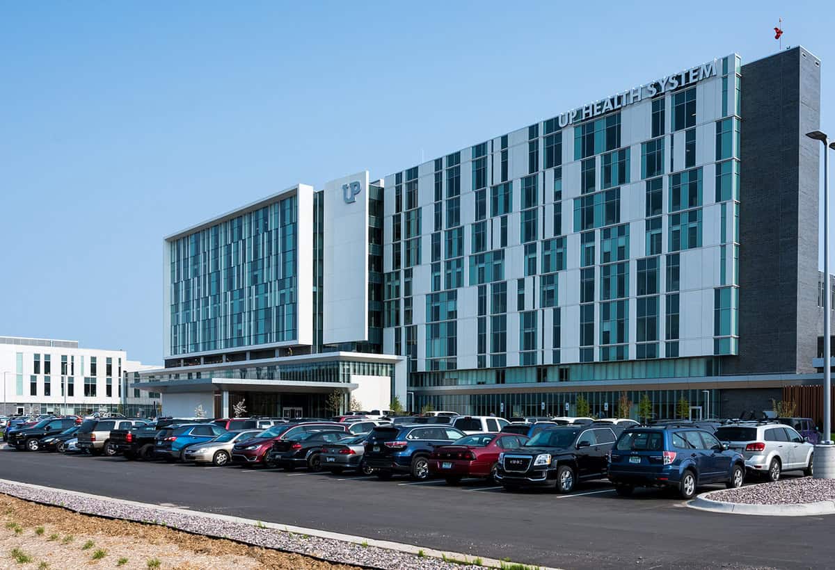 Angled view of Marquette Hospital during the daytime.